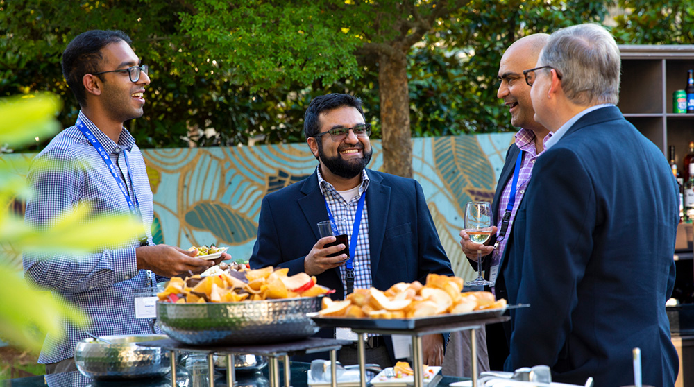 4 women wearing lanyards