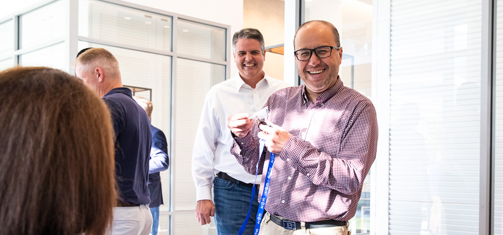 4 women wearing lanyards
